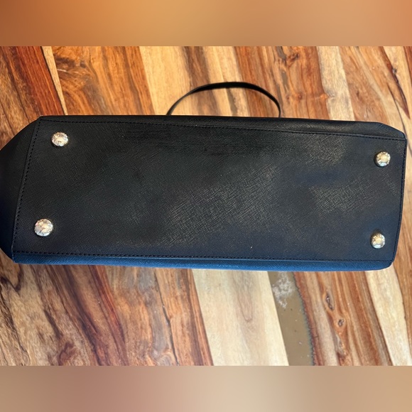 Black hard leather Michael kors handbag. 14 inches wide by 10 inches tall. - Picture 5 of 7